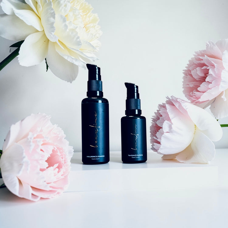 wo skincare products from the Blooming Duet collection, displayed side by side, featuring clean, minimal packaging that reflects a hydrating and nourishing skincare duo designed for skin balance and harmony.